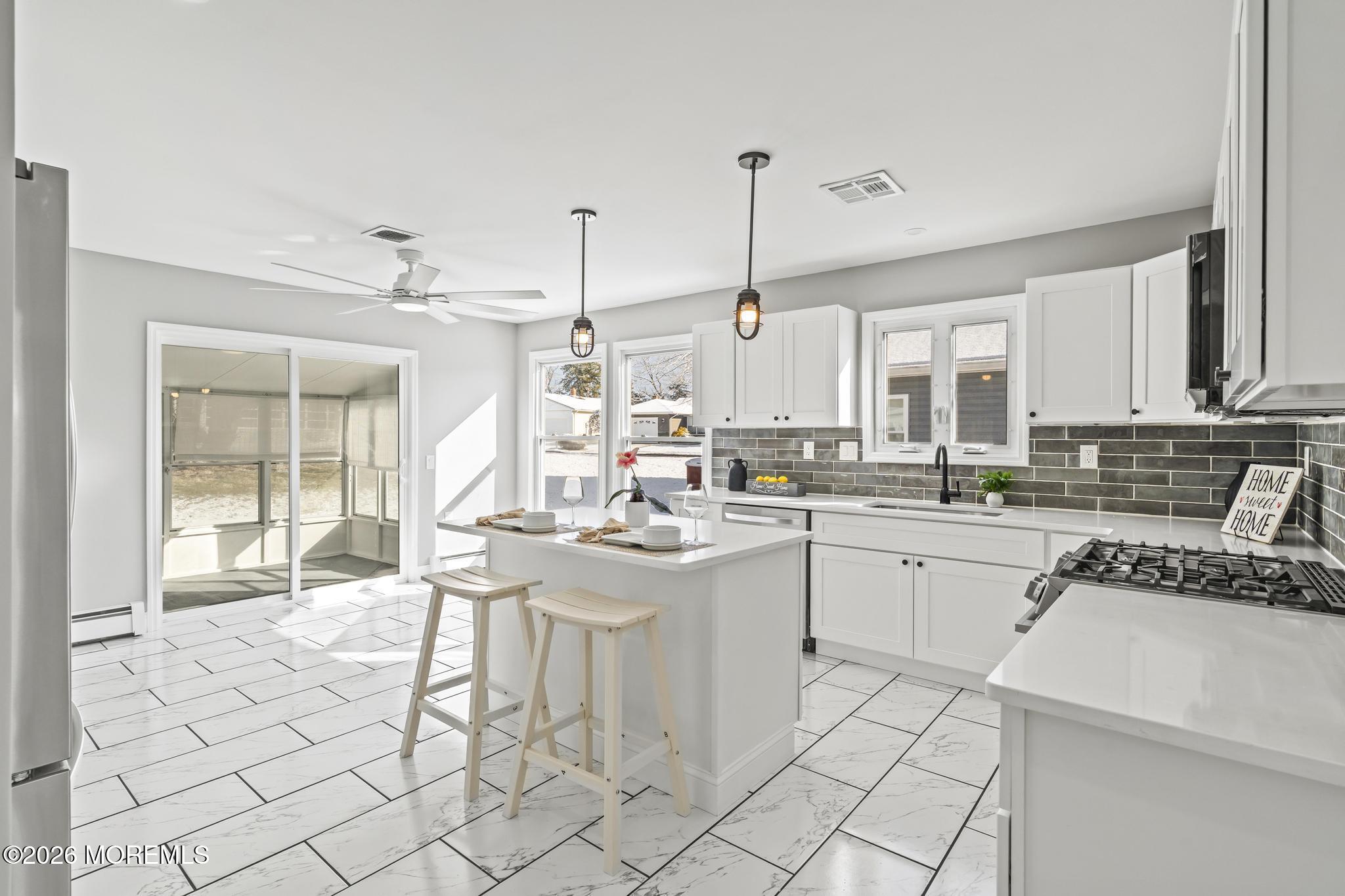 3 Muirhead Street Toms River, NJ 08757 - Photo 13 of 34 a kitchen with stainless steel appliances kitchen island granite countertop a sink and cabinets