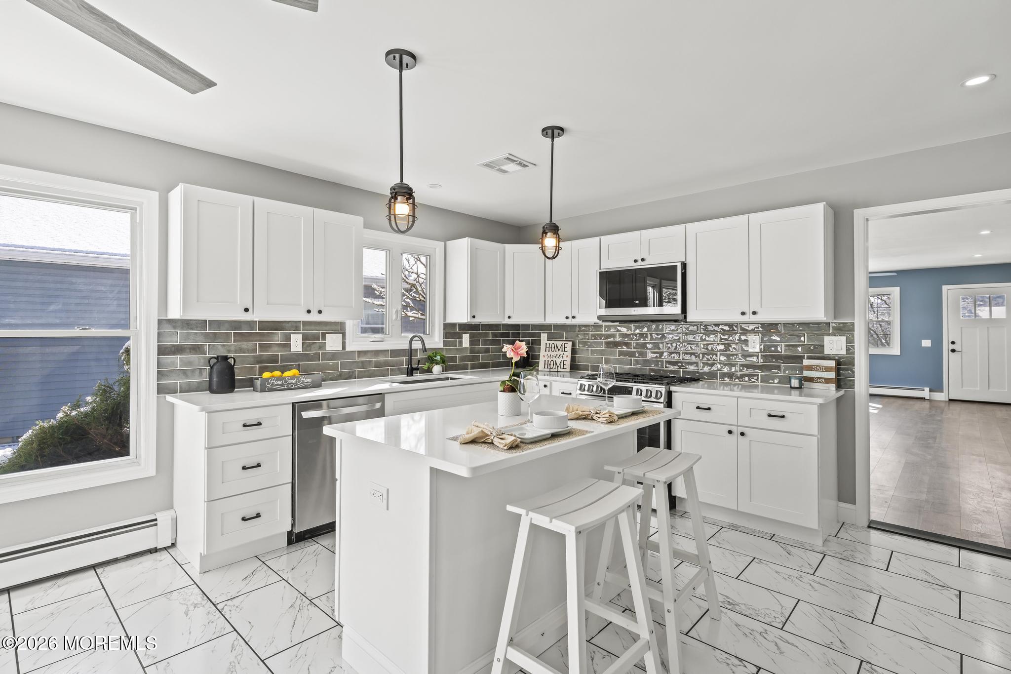 3 Muirhead Street Toms River, NJ 08757 - Photo 14 of 34 a kitchen with white cabinets and white appliances