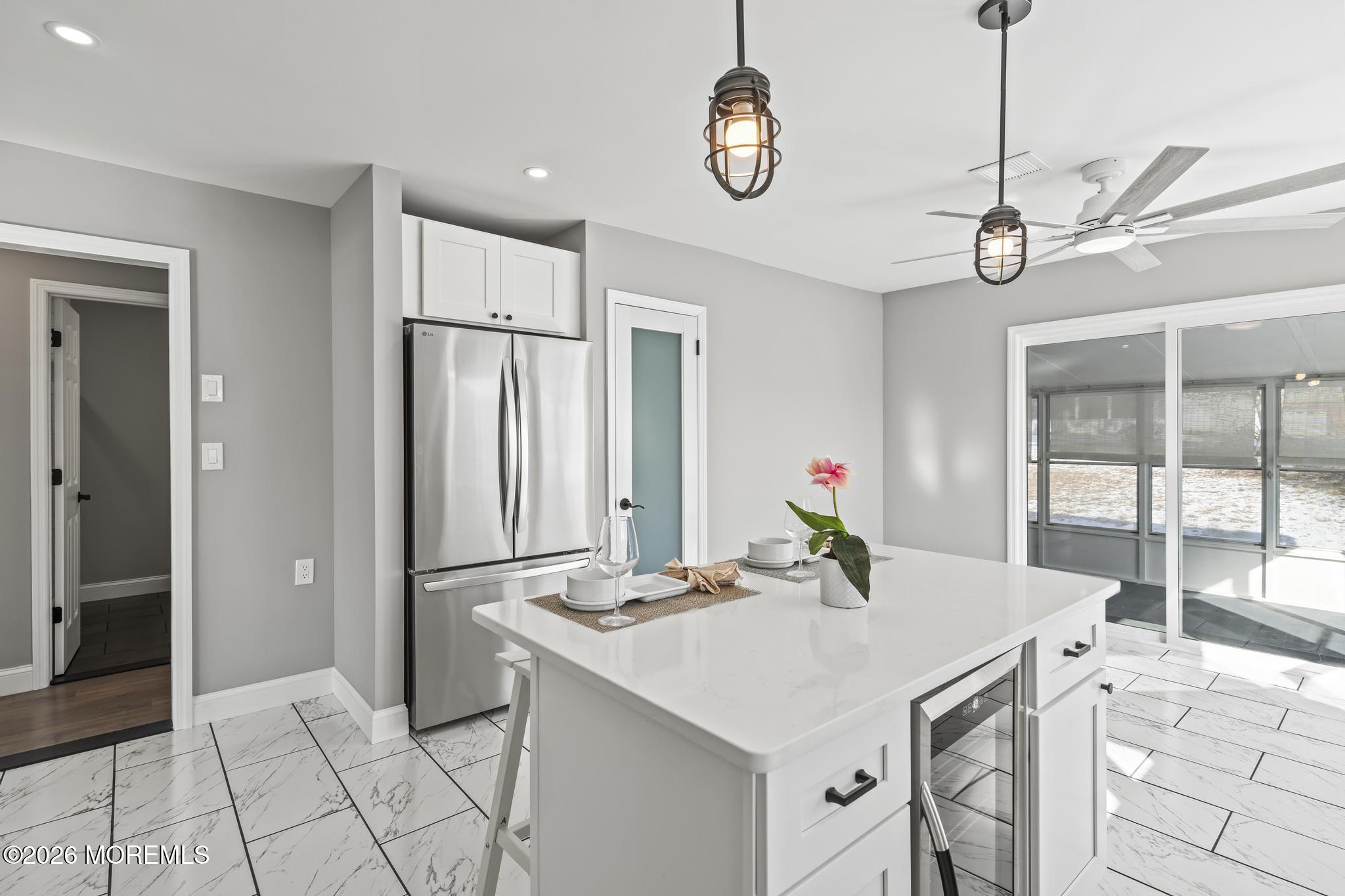 3 Muirhead Street Toms River, NJ 08757 - Photo 16 of 34 a view of kitchen island with furniture and chandelier