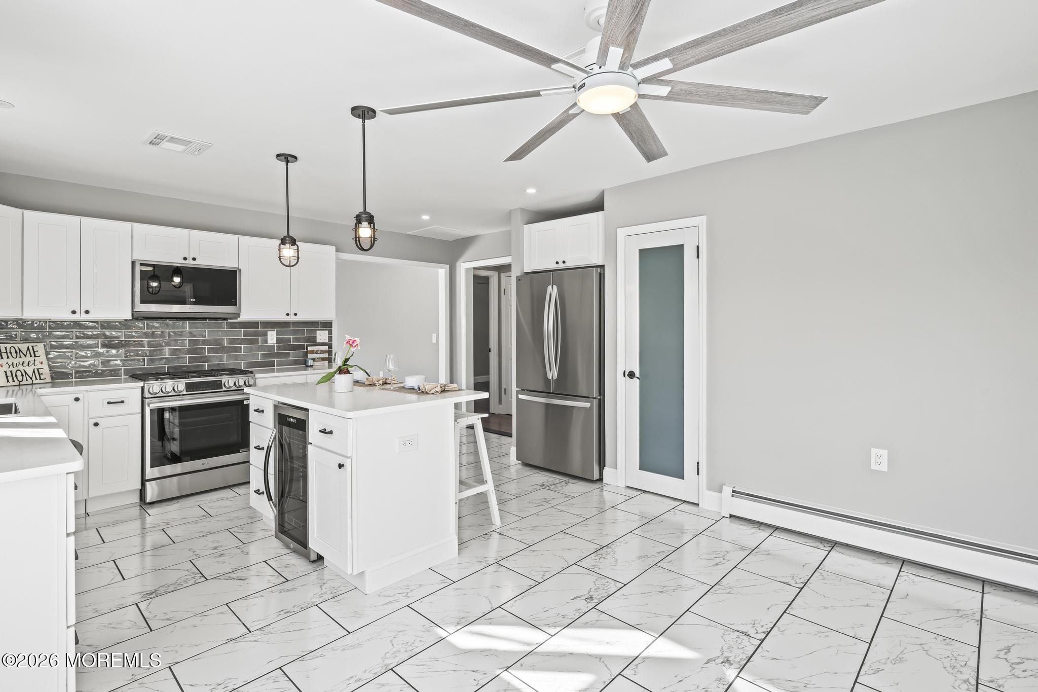 3 Muirhead Street Toms River, NJ 08757 - Photo 18 of 34 a kitchen with a stove a sink and a refrigerator