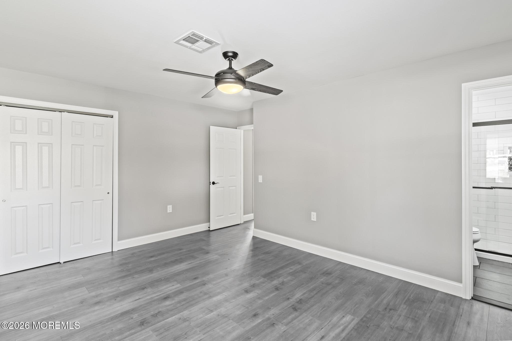 3 Muirhead Street Toms River, NJ 08757 - Photo 22 of 34 a view of an empty room with wooden floor and a window