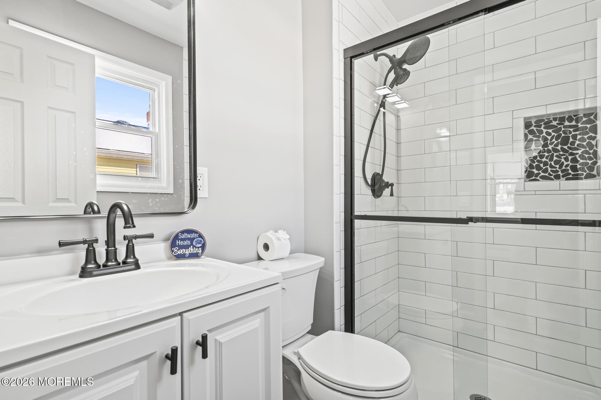 3 Muirhead Street Toms River, NJ 08757 - Photo 25 of 34 a bathroom with a sink a toilet and shower