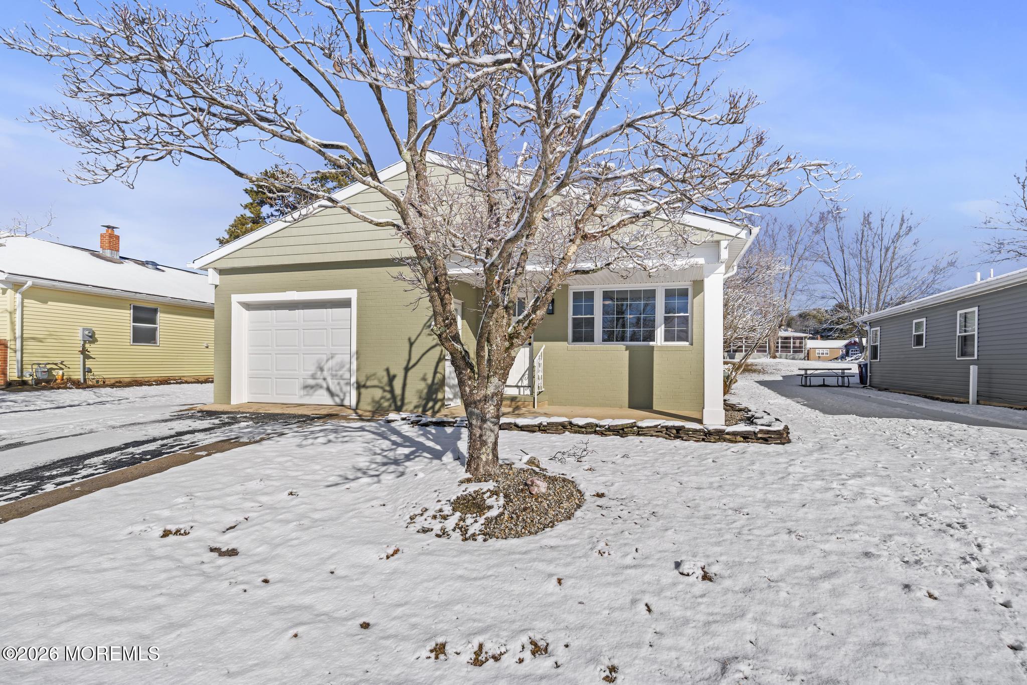 3 Muirhead Street Toms River, NJ 08757 - Photo 3 of 34 a front view of a house with a yard covered in snow