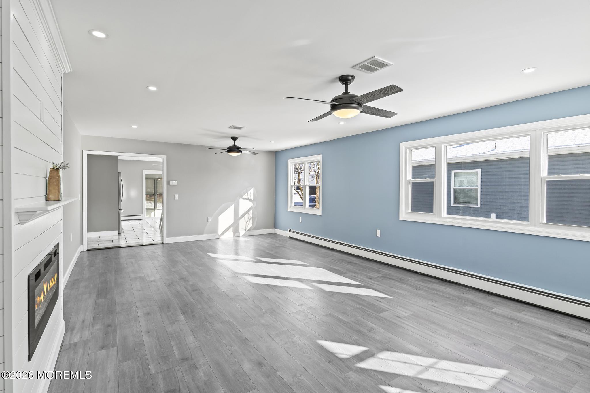 3 Muirhead Street Toms River, NJ 08757 - Photo 6 of 34 a view of empty room with wooden floor and fan