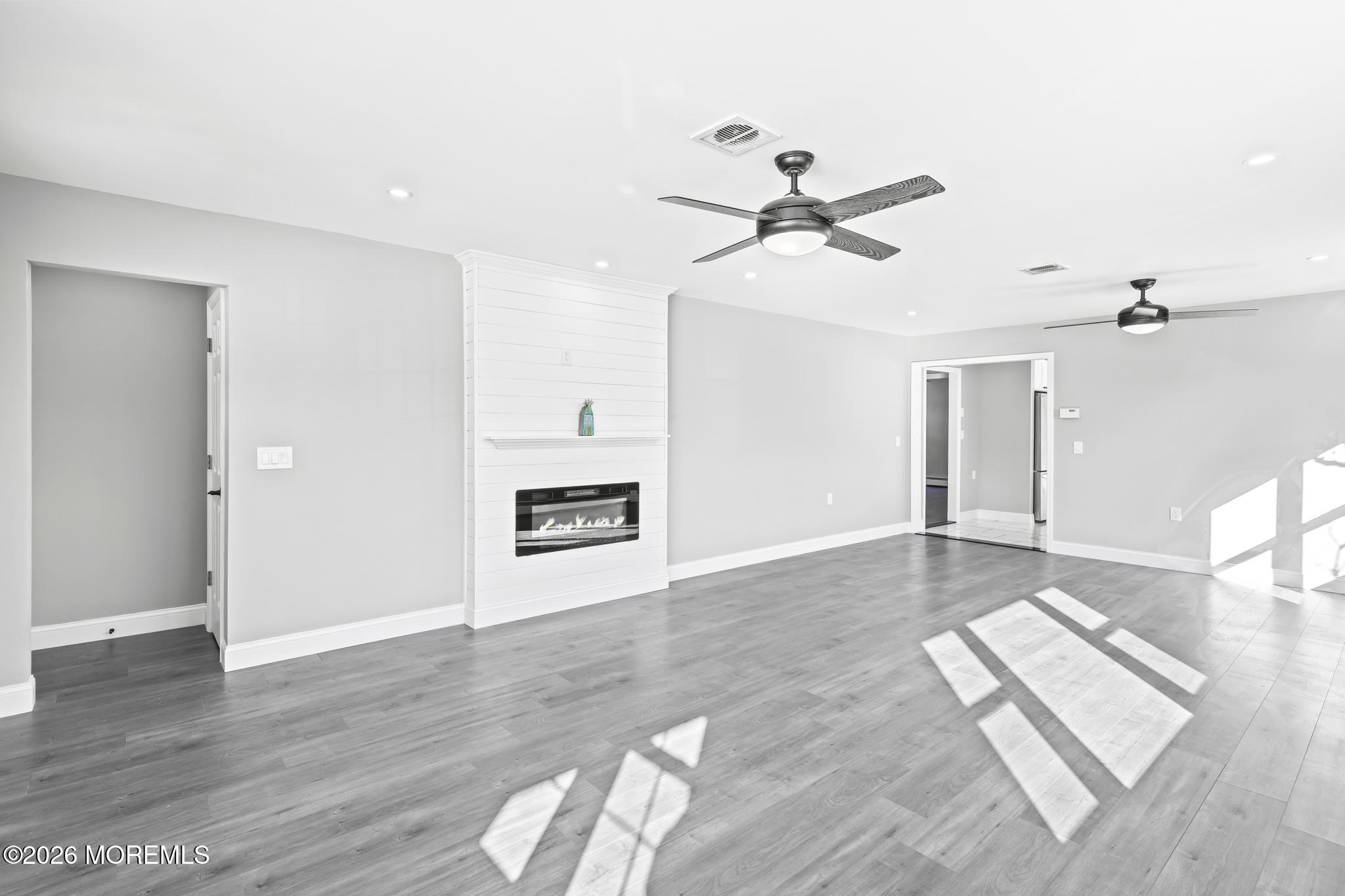 3 Muirhead Street Toms River, NJ 08757 - Photo 7 of 34 a view of a room with wooden floor and ceiling fan
