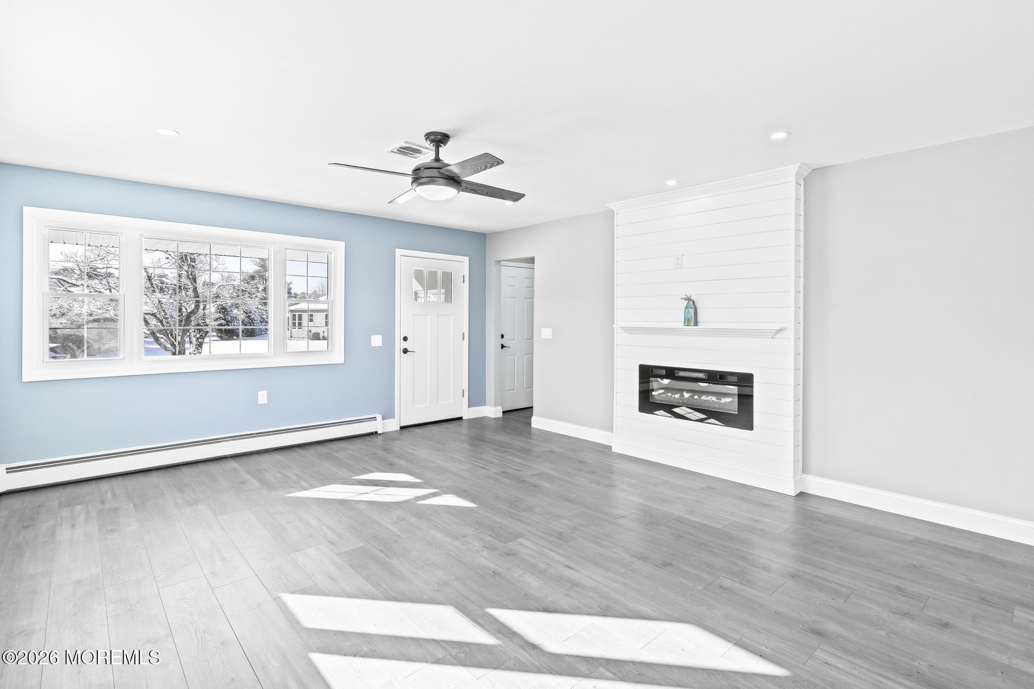 3 Muirhead Street Toms River, NJ 08757 - Photo 8 of 34 a view of an empty room with a window and wooden floor