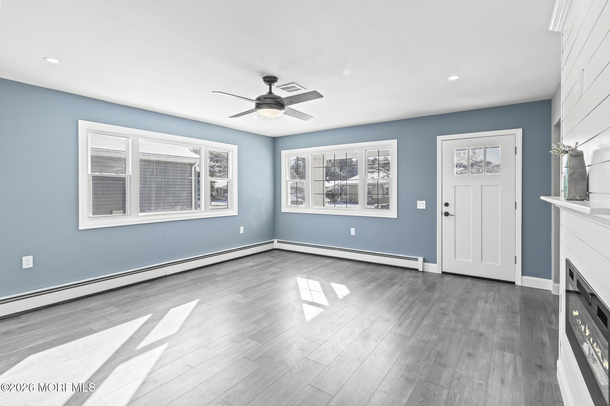 3 Muirhead Street Toms River, NJ 08757 - Photo 10 of 34 a view of an empty room with a window and wooden floor