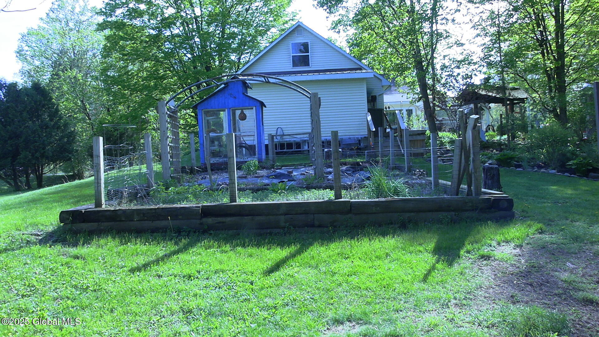 116 Dennie Road Mayfield, NY 12117 - Photo 54 of 58 Side of Home Through Garden
