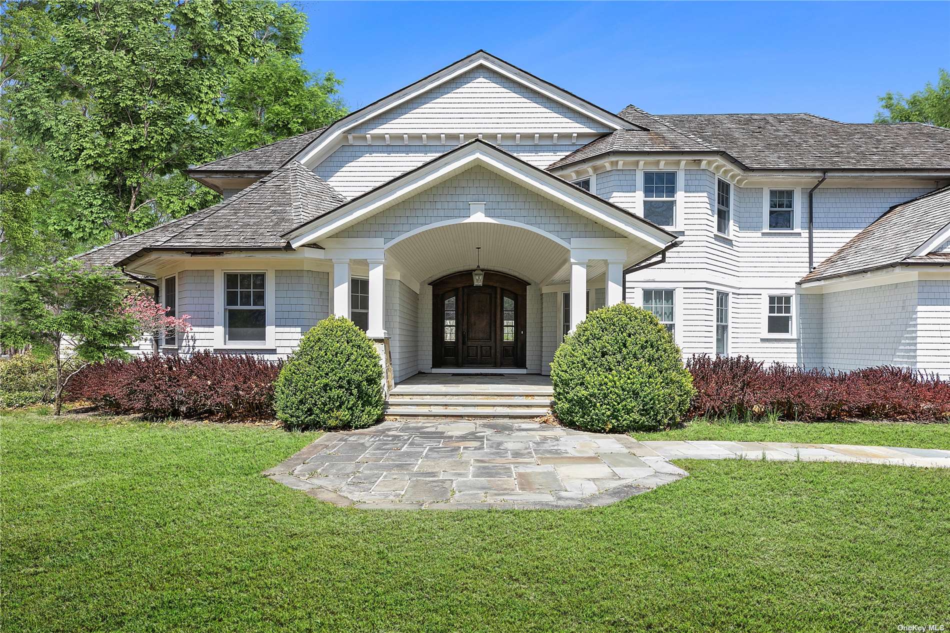 a view of a front of a house with a yard