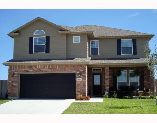 307 Calley Springs Street Portland, TX 78374 - Photo 1 of 10 a front view of a house with garden