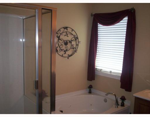 307 Calley Springs Street Portland, TX 78374 - Photo 7 of 10 a bathroom with a bathtub and shower