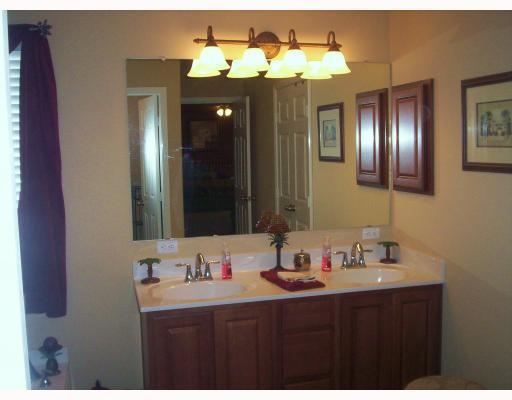 307 Calley Springs Street Portland, TX 78374 - Photo 8 of 10 a bathroom with a sink and a mirror