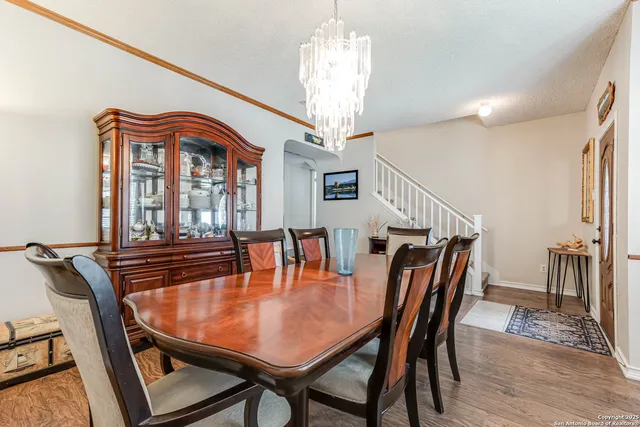 a dining room with furniture and window