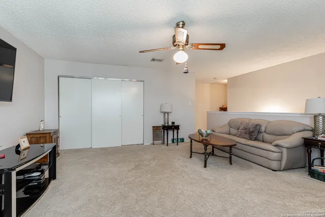 a bedroom with furniture and a chandelier