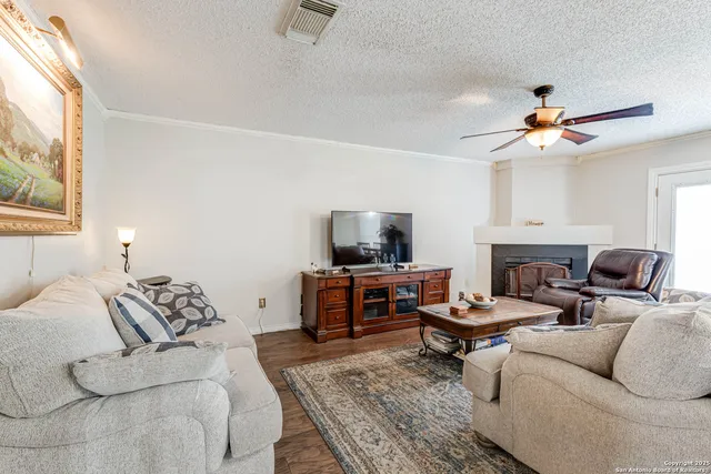 a living room with furniture or couch and a flat screen tv