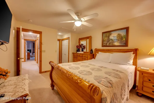 a bedroom with a bed and a chandelier