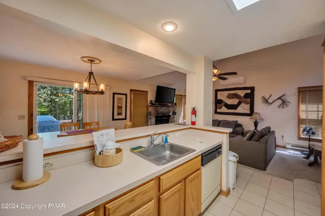 a living room with furniture and flat screen tv