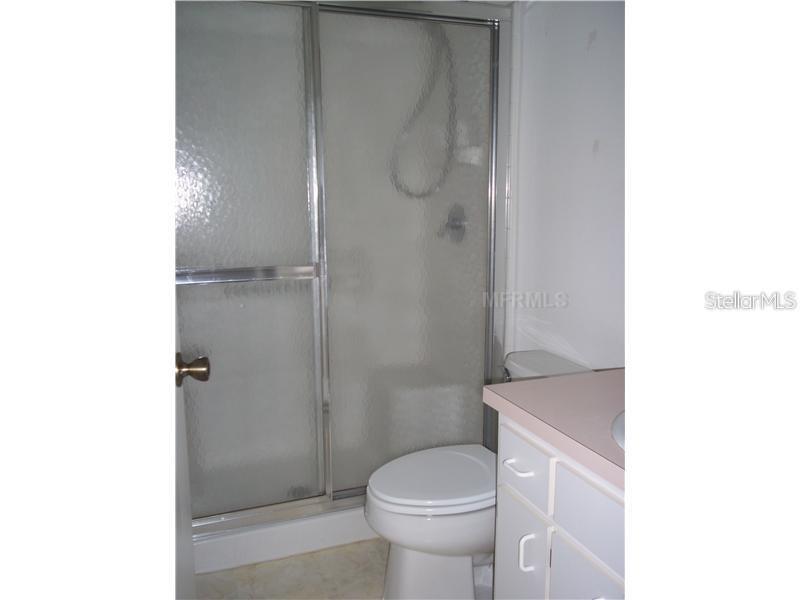 2464 Nantucket Harbor Loop, Unit 96 Sun City Center, FL 33573 - Photo 12 of 19 a bathroom with a shower and a toilet