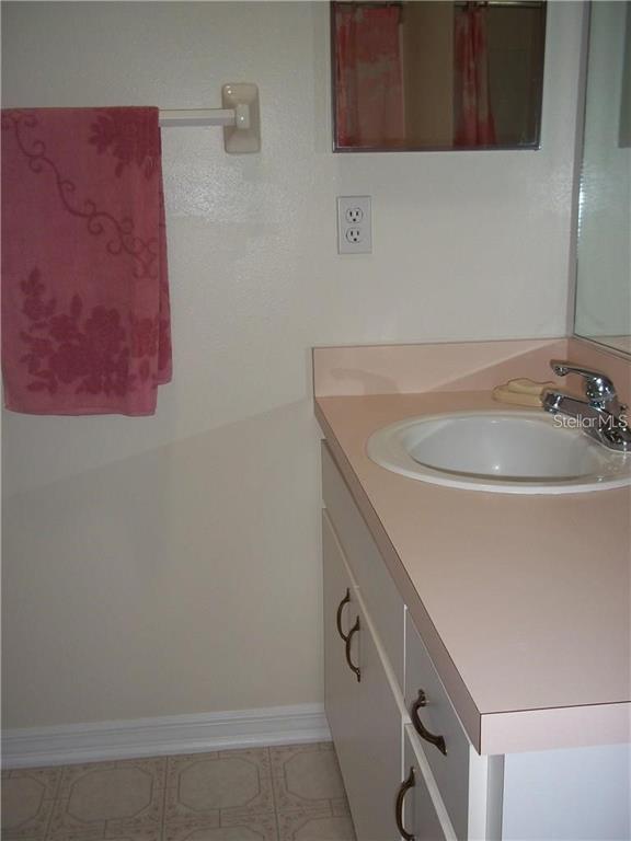 2464 Nantucket Harbor Loop, Unit 96 Sun City Center, FL 33573 - Photo 13 of 19 a bathroom with a sink