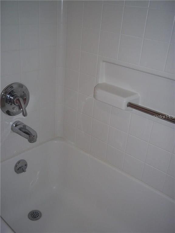 2464 Nantucket Harbor Loop, Unit 96 Sun City Center, FL 33573 - Photo 17 of 19 a close up of a shower