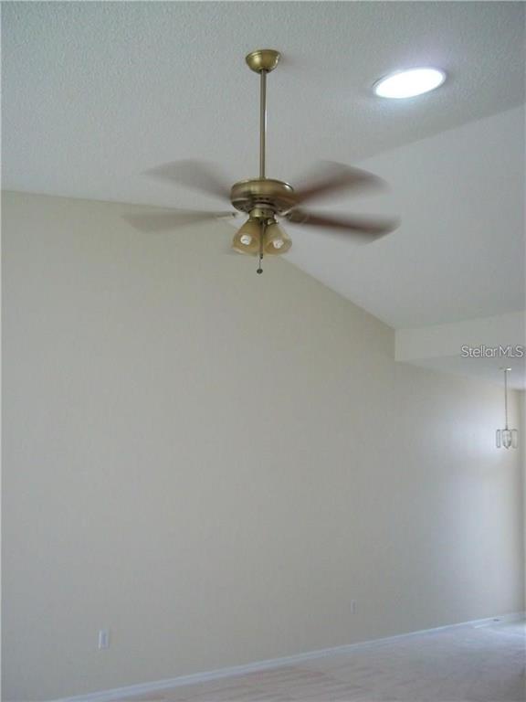 2464 Nantucket Harbor Loop, Unit 96 Sun City Center, FL 33573 - Photo 5 of 19 a view of a room with a chandelier fan and wooden floor