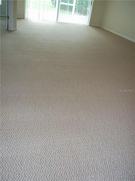 2464 Nantucket Harbor Loop, Unit 96 Sun City Center, FL 33573 - Photo 6 of 19 a view of room and yard