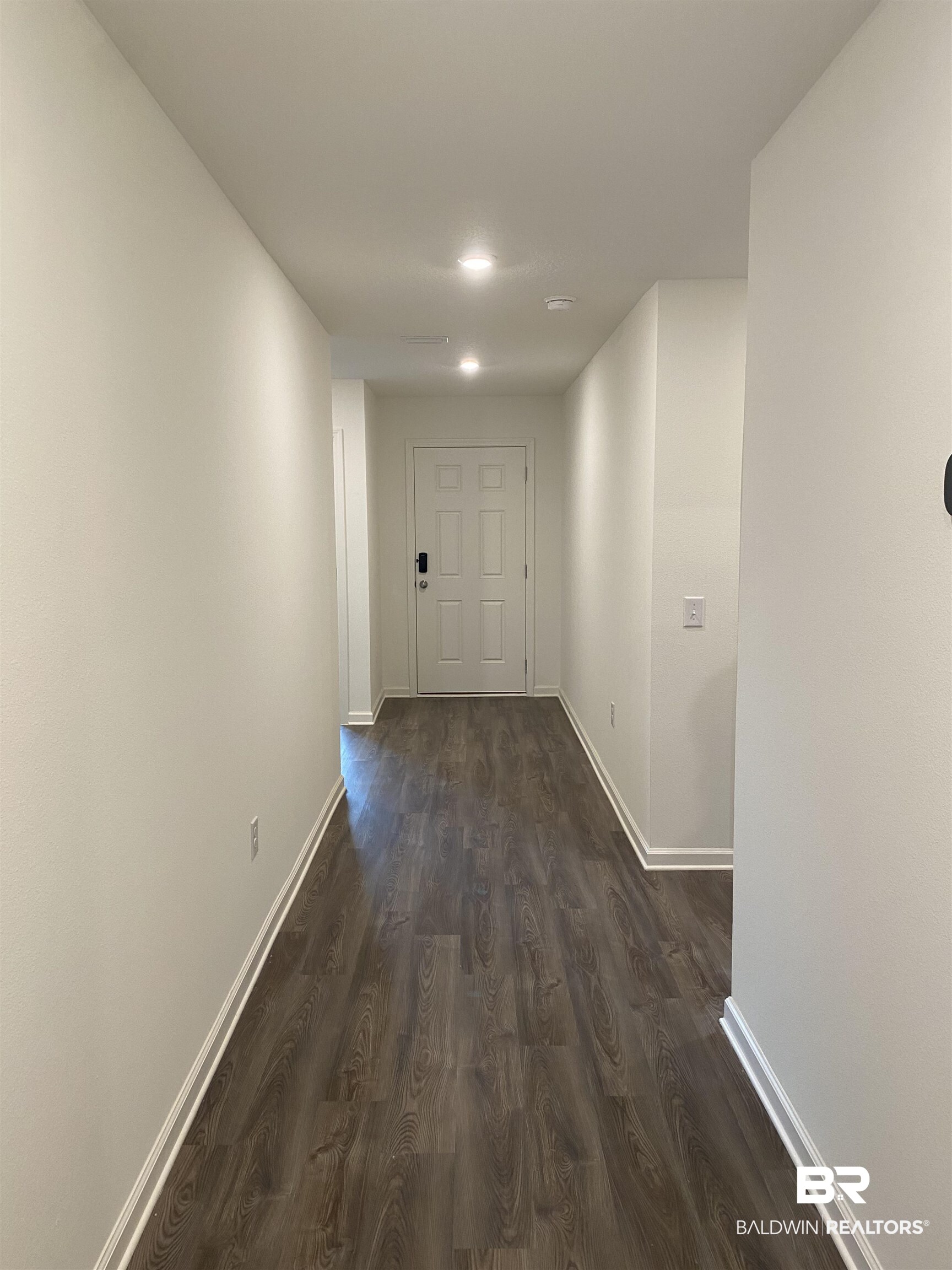 21676 Yosemite Boulevard Fairhope, AL 36532 - Photo 6 of 19 Hall with dark wood-type flooring