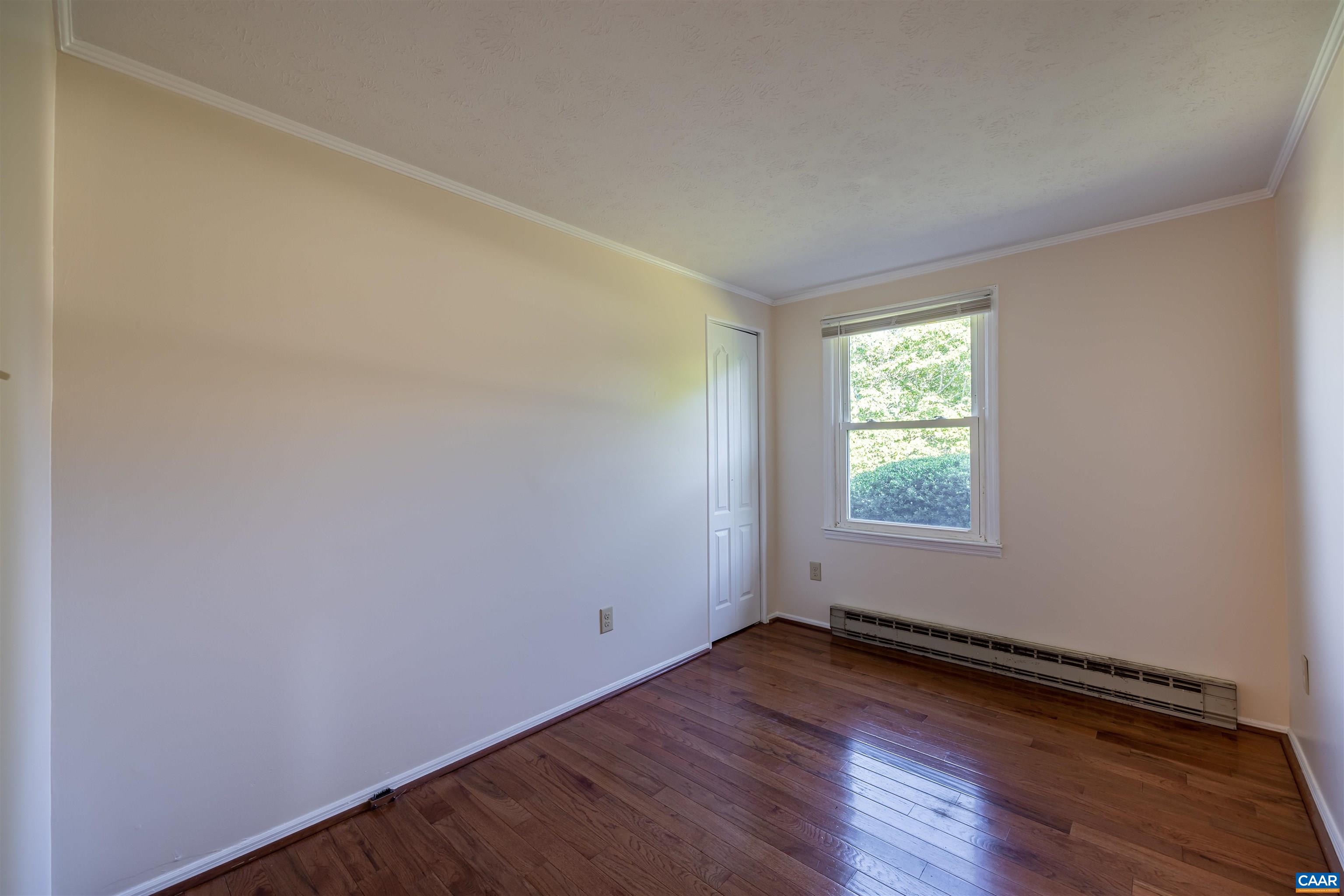 22 Rucker Drive Ruckersville, VA 22968 - Photo 10 of 26 an empty room with wooden floor and windows