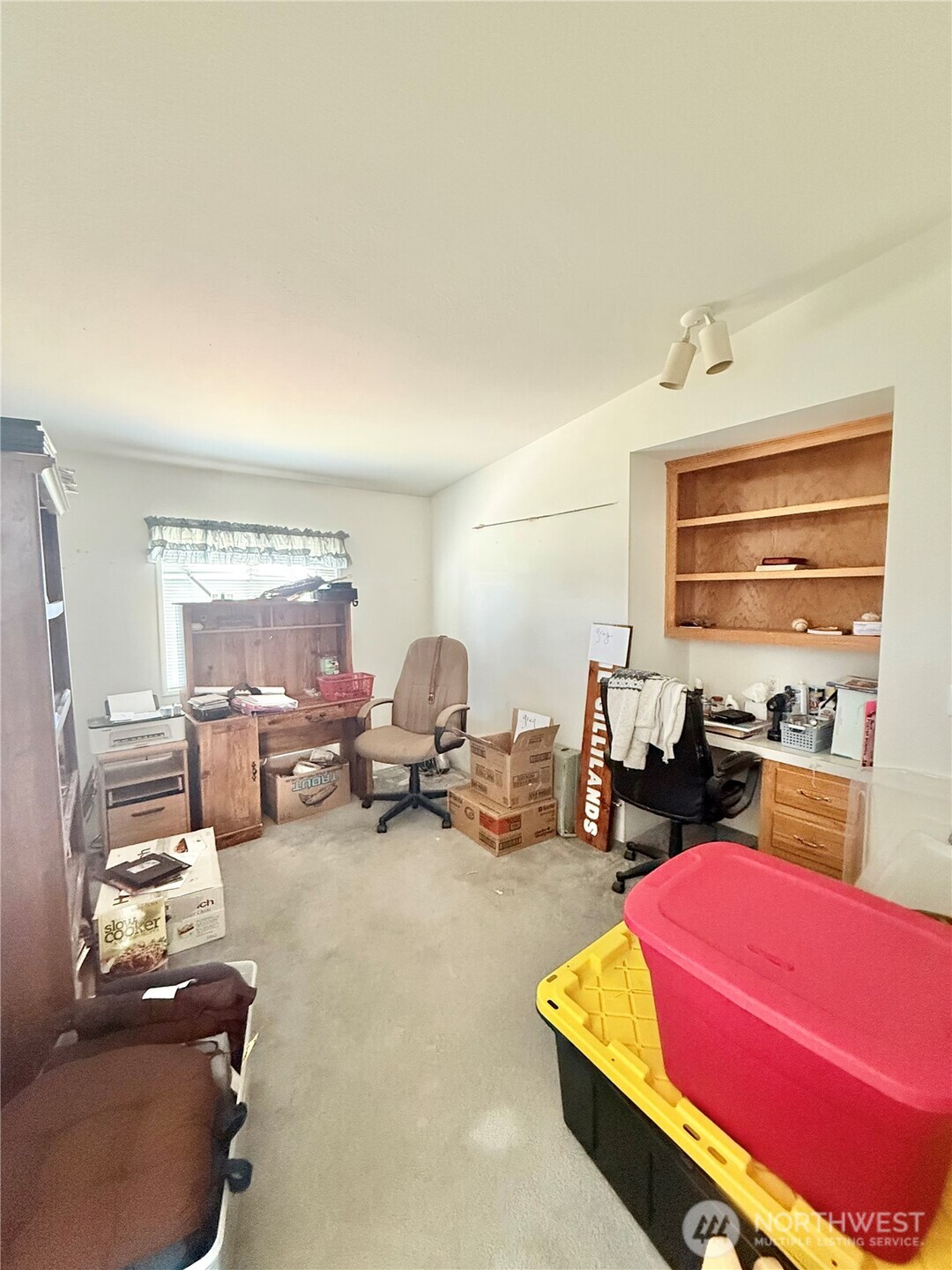 84 Weatherstone Road Omak, WA 98841 - Photo 13 of 17 a living room with furniture a window and a table