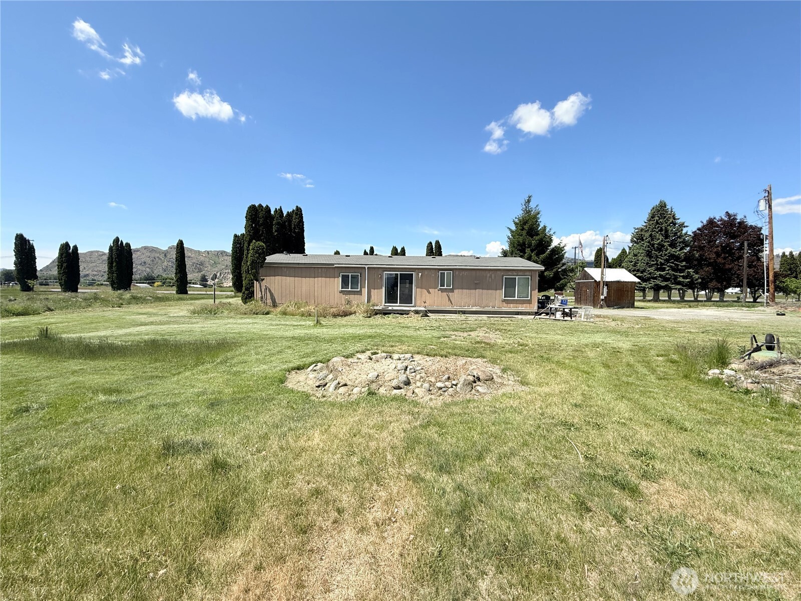 84 Weatherstone Road Omak, WA 98841 - Photo 3 of 17 a house view with swimming pool