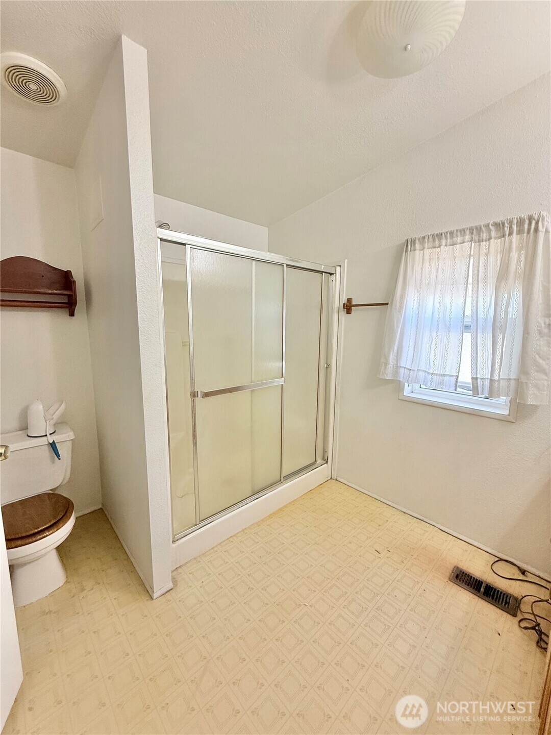 84 Weatherstone Road Omak, WA 98841 - Photo 9 of 17 a view of an empty room with a window