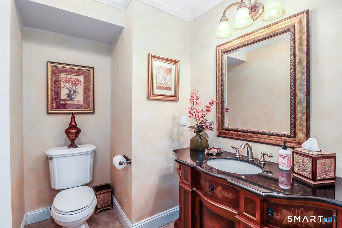 427 Long Mountain Road New Milford, CT 06776 - Photo 12 of 40 a bathroom with a sink a toilet and mirror
