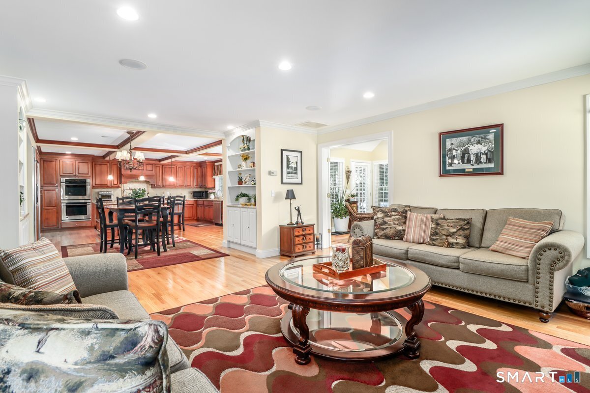 427 Long Mountain Road New Milford, CT 06776 - Photo 16 of 40 a living room with furniture and a view of kitchen