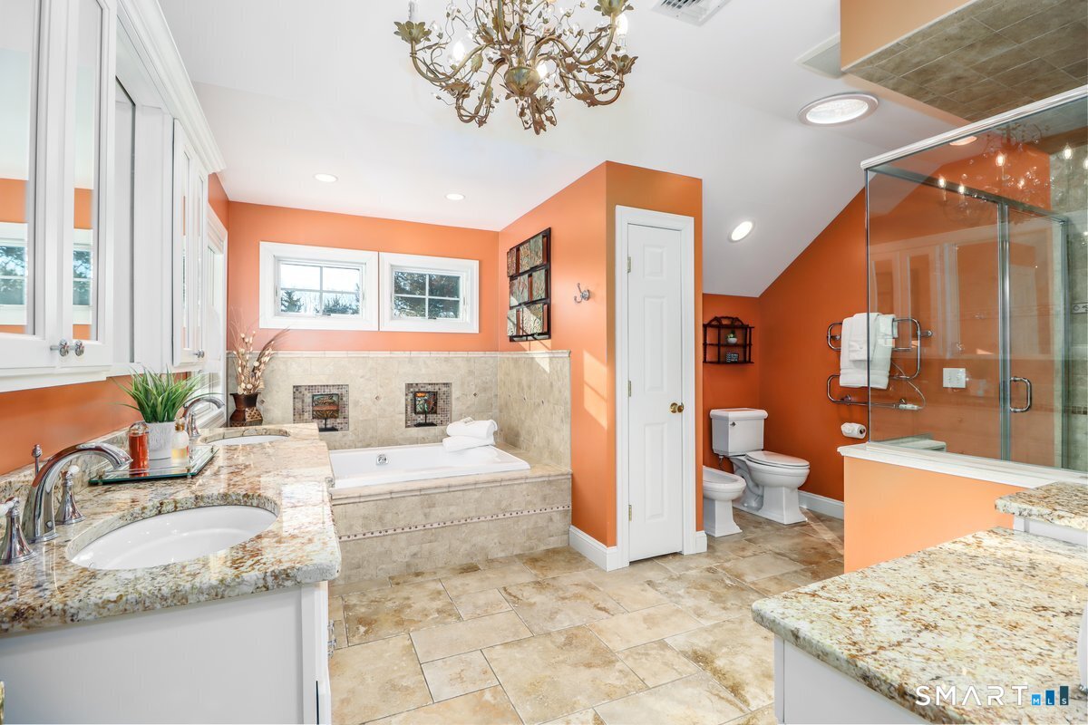 427 Long Mountain Road New Milford, CT 06776 - Photo 22 of 40 a bathroom with a granite countertop sink and a large mirror