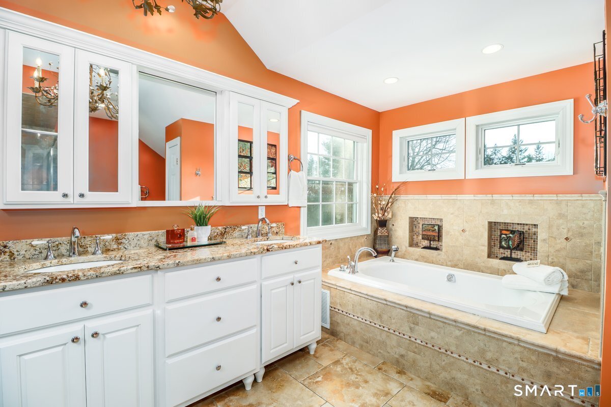 427 Long Mountain Road New Milford, CT 06776 - Photo 23 of 40 a bathroom with a tub sink and mirror
