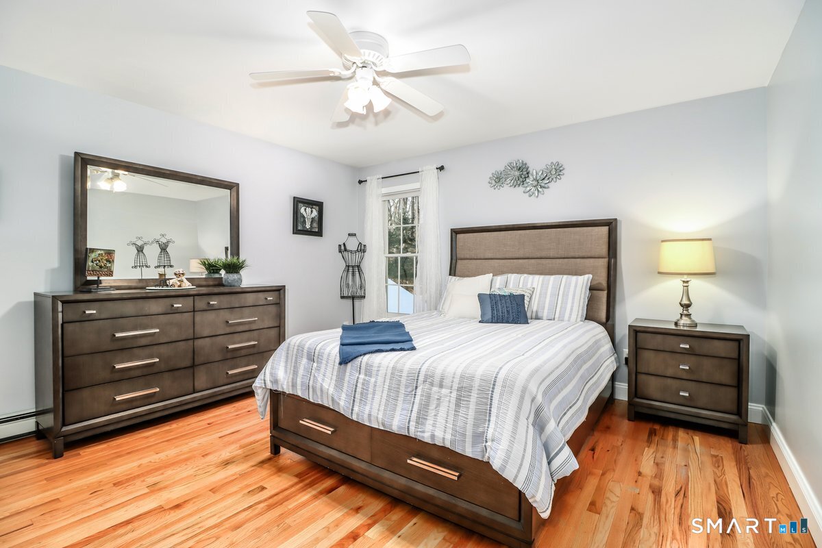 427 Long Mountain Road New Milford, CT 06776 - Photo 24 of 40 a bedroom with a bed and a dresser