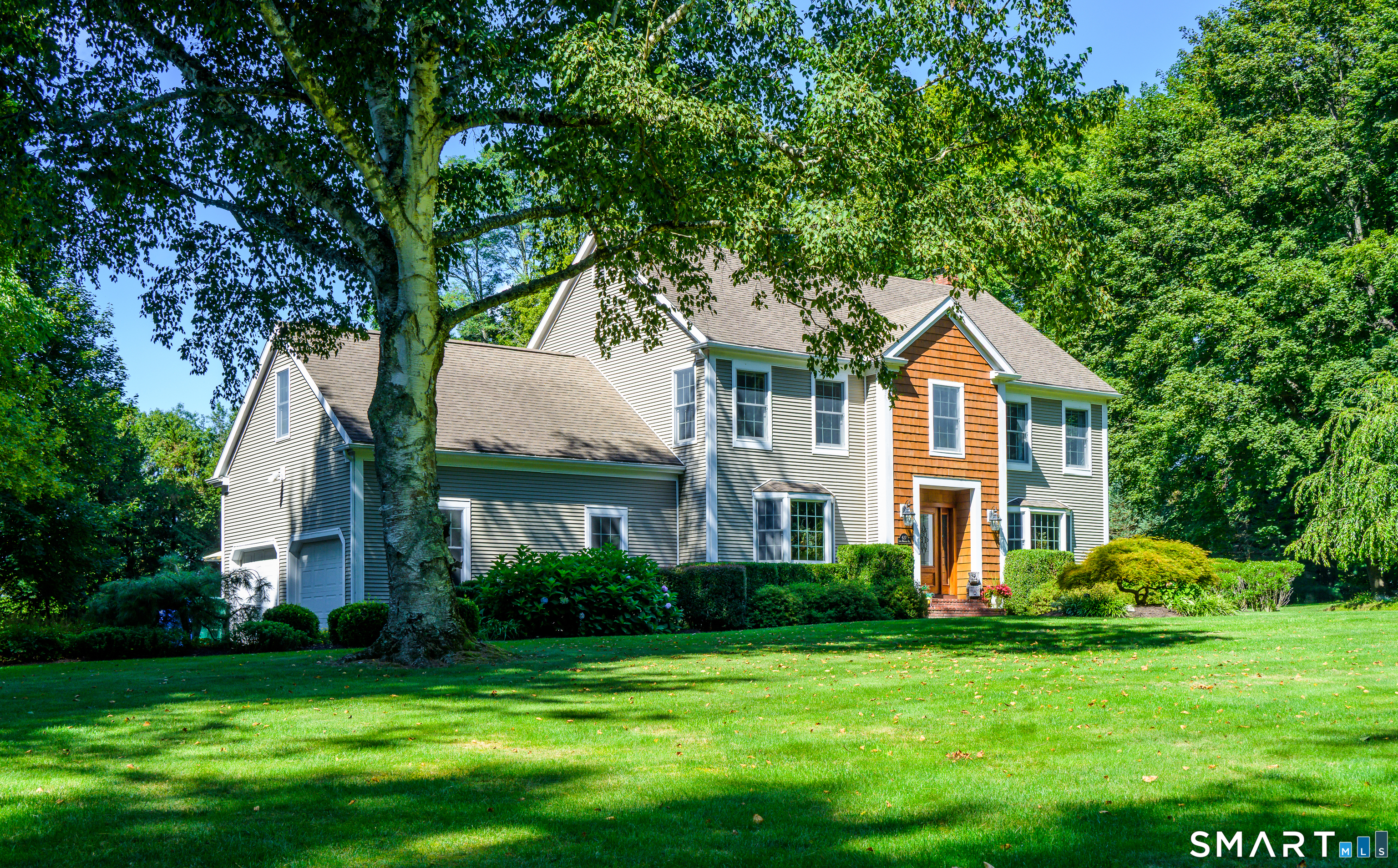 427 Long Mountain Road New Milford, CT 06776 - Photo 3 of 40 a front view of a house with a yard