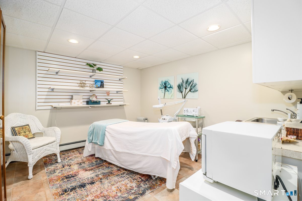 427 Long Mountain Road New Milford, CT 06776 - Photo 31 of 40 a bedroom with a bed and a window