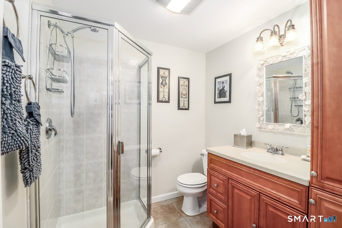 427 Long Mountain Road New Milford, CT 06776 - Photo 32 of 40 a bathroom with a granite countertop sink toilet and shower