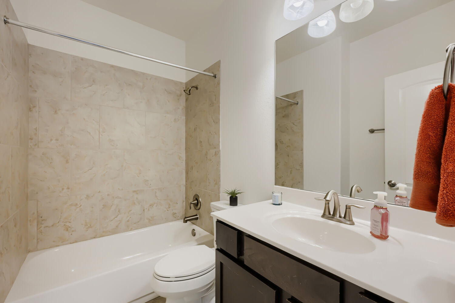 6715 Windrift Way, Unit 28 Austin, TX 78745 - Photo 17 of 19 Second full bath with shower-tub combination vanity with drawers