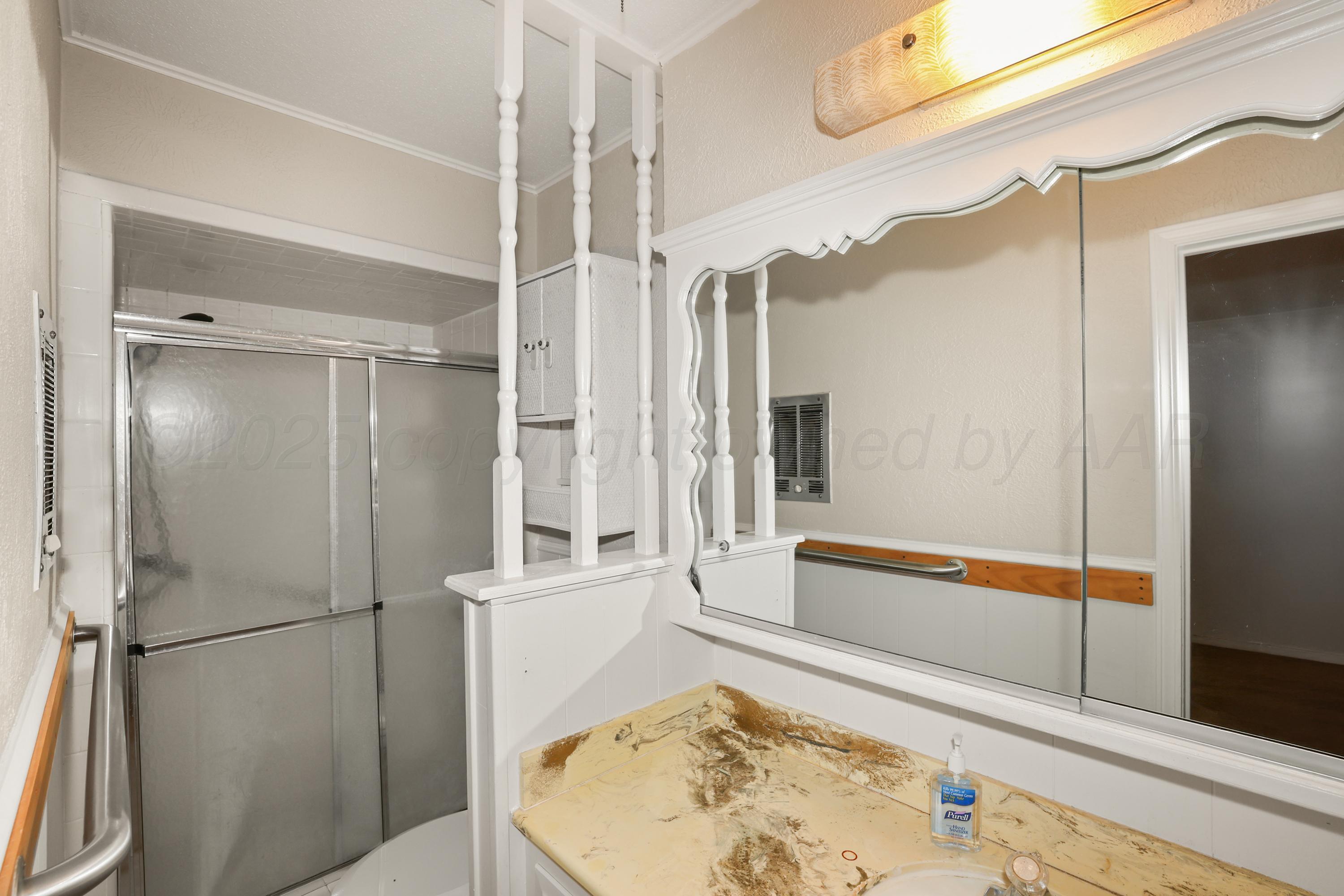 7682 Back Acres Road Amarillo, TX 79119 - Photo 11 of 27 a bathroom with a tub and shower