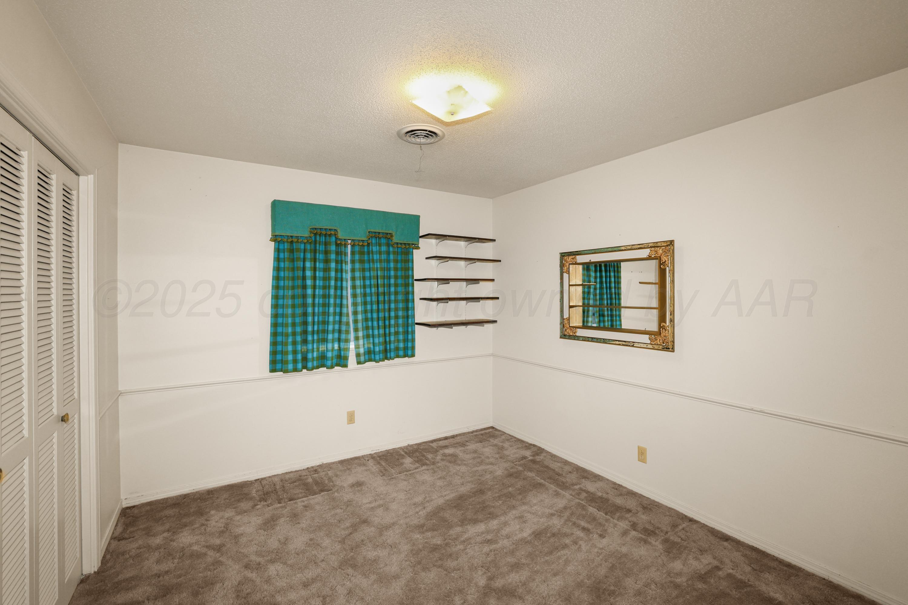 7682 Back Acres Road Amarillo, TX 79119 - Photo 13 of 27 a view of an empty room with a window