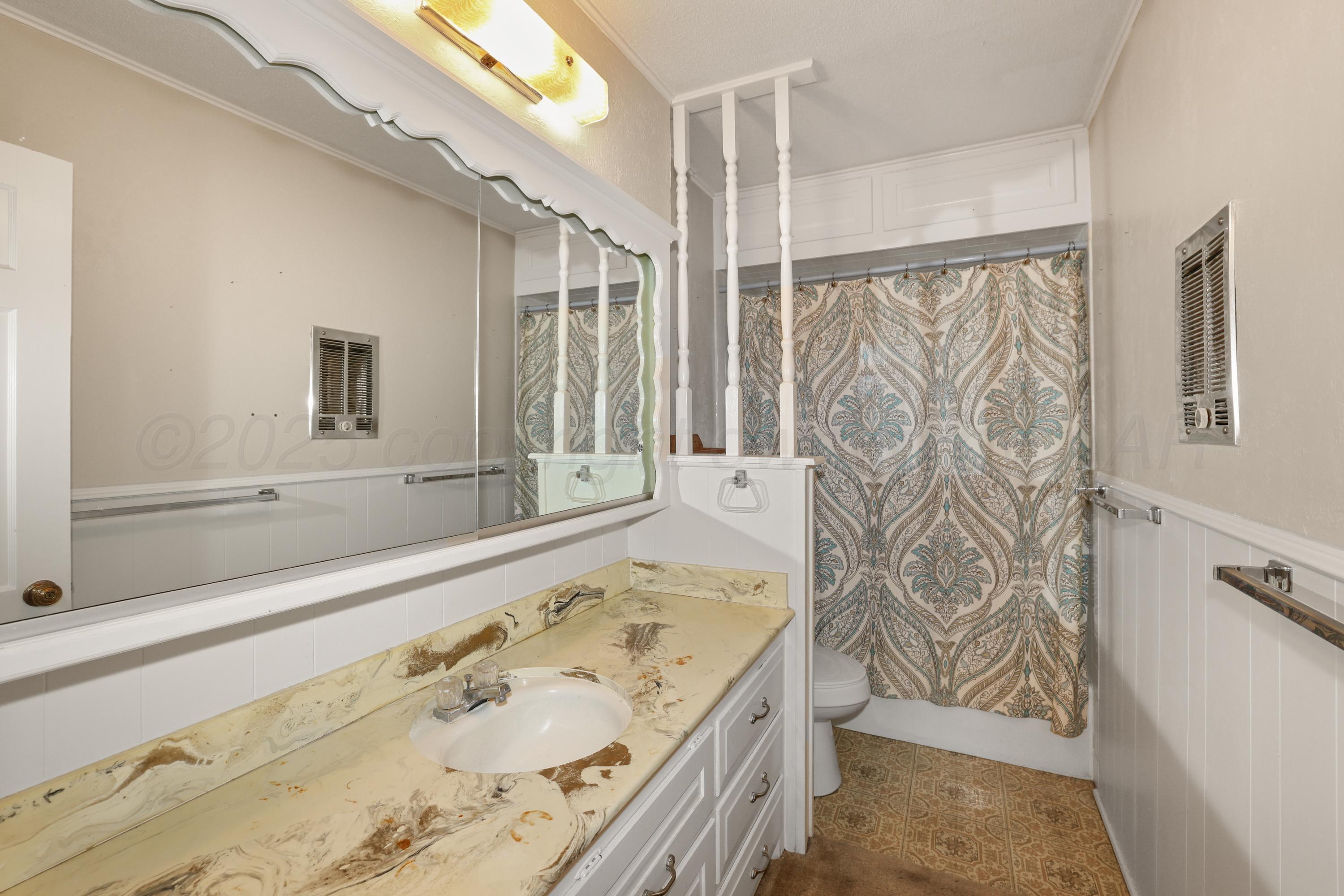 7682 Back Acres Road Amarillo, TX 79119 - Photo 15 of 27 a bathroom with a bathtub and shower