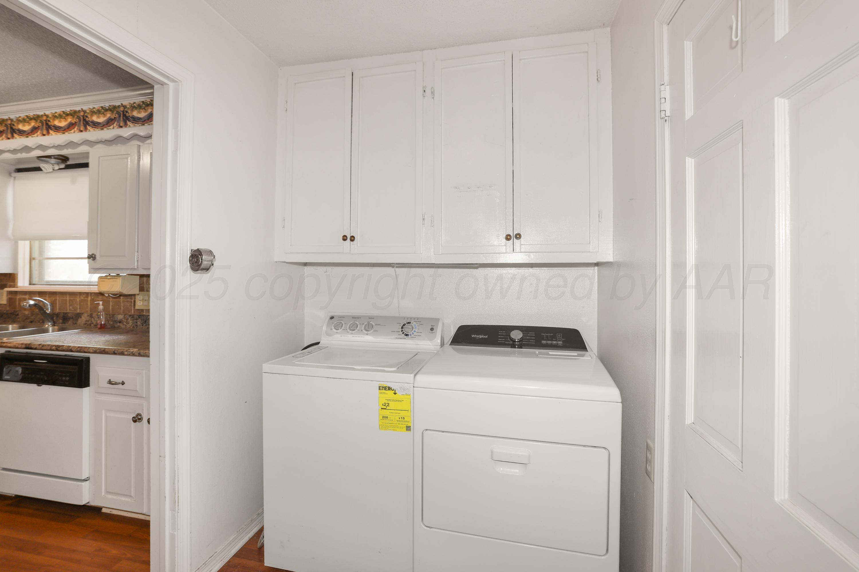 7682 Back Acres Road Amarillo, TX 79119 - Photo 16 of 27 a utility room with dryer and washer
