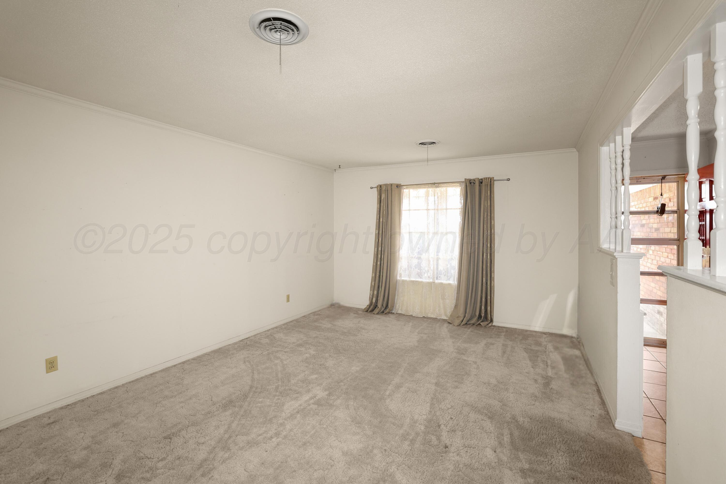 7682 Back Acres Road Amarillo, TX 79119 - Photo 3 of 27 a view of an empty room with a window