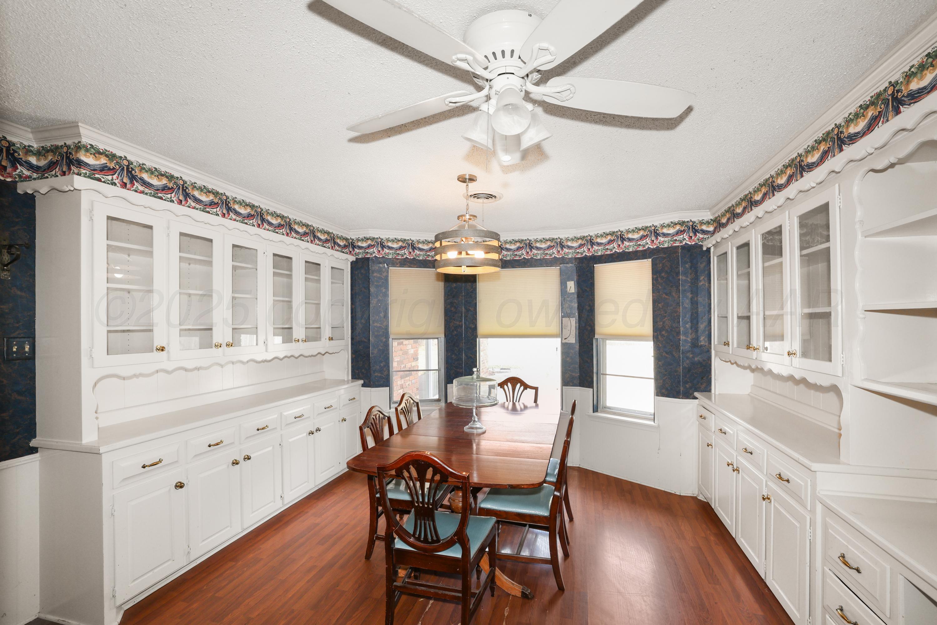 7682 Back Acres Road Amarillo, TX 79119 - Photo 5 of 27 a view of a dining room with furniture window and wooden floor