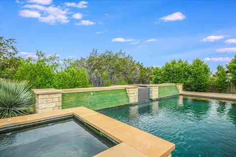 a view of a pool with a yard