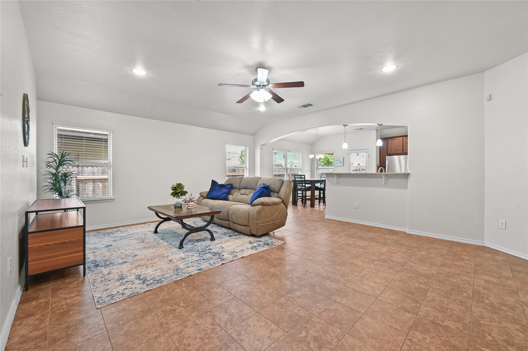 303 Limerick Road Buda, TX 78610 - Photo 2 of 23 Spacious living area featuring tiled flooring, recessed lighting, and a ceiling fan