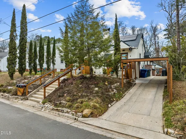a view of a street with houses on the road