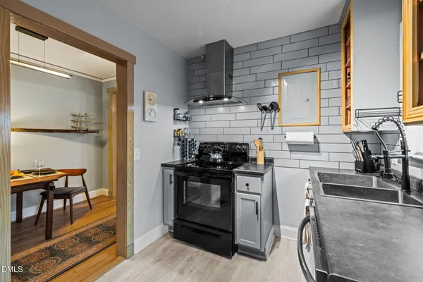a kitchen with a stove and a microwave